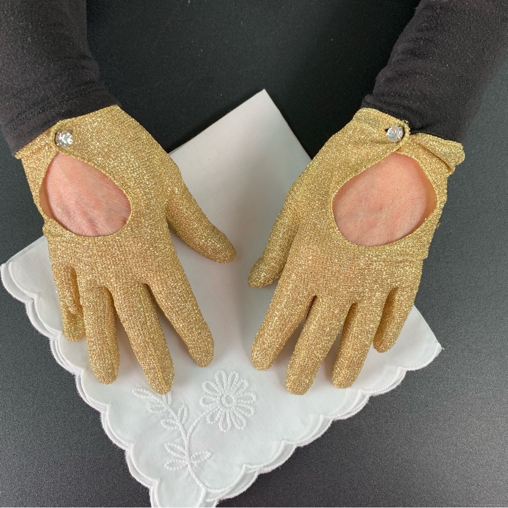 Gold metallic sparkling gloves.